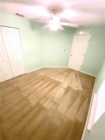 a bedroom with a bed and a mirror