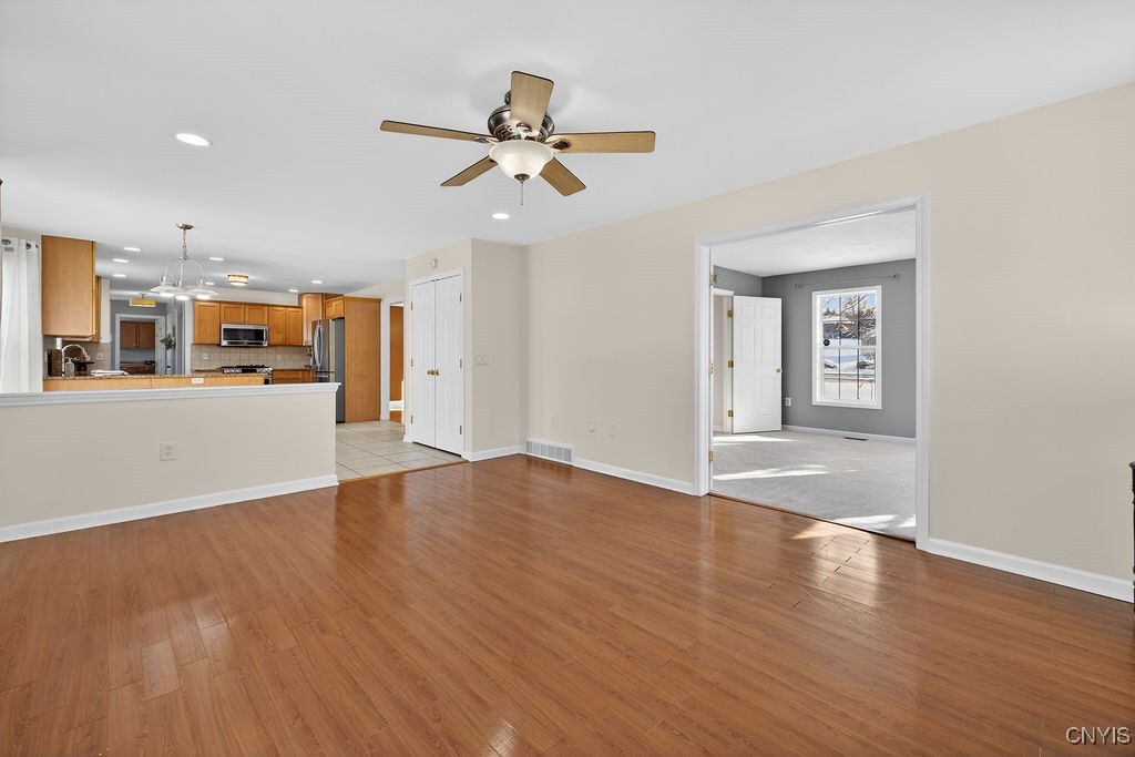 4326 Chilmark Street Marcellus, NY 13108 - Photo 11 of 49 Family room that is open to the kitchen giving thi