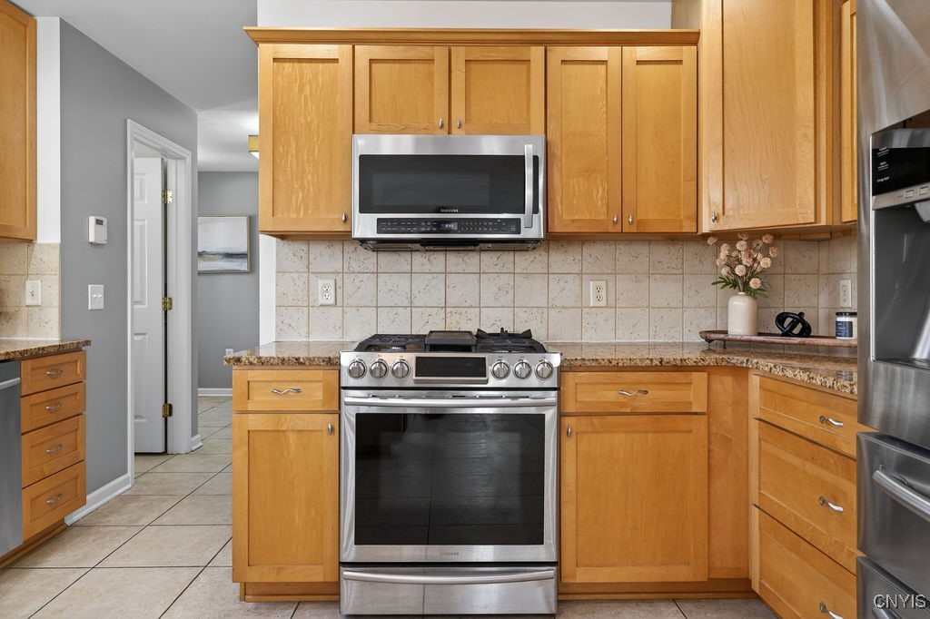 4326 Chilmark Street Marcellus, NY 13108 - Photo 22 of 49 Hallway leaads to the half bath, mudroom and a fir