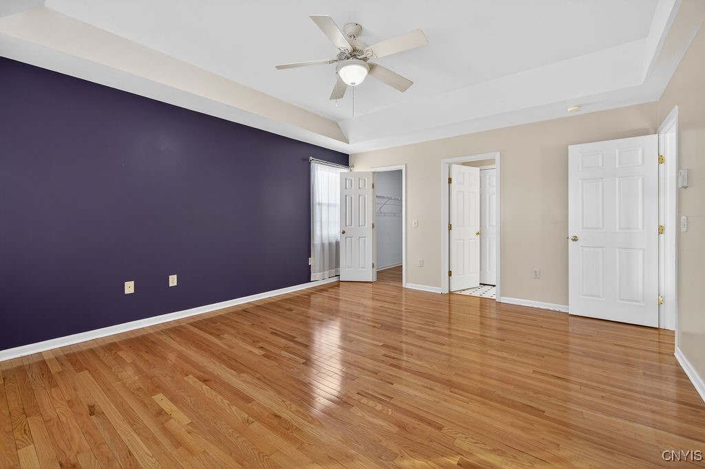 4326 Chilmark Street Marcellus, NY 13108 - Photo 36 of 49 Primary bedroom with hardwood flooring, walk in cl