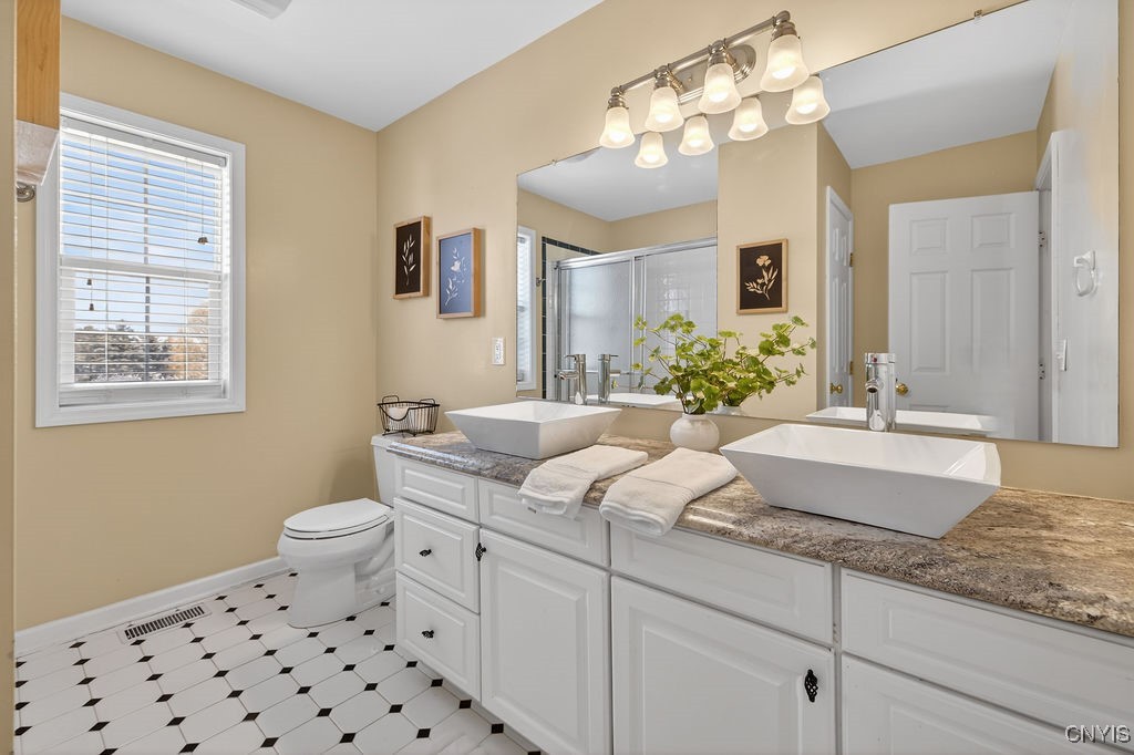 4326 Chilmark Street Marcellus, NY 13108 - Photo 39 of 49 Primary bath with dual vanities, walk in shower an