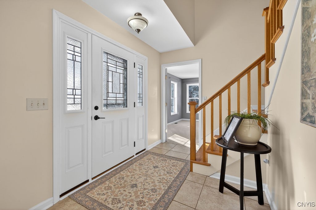 4326 Chilmark Street Marcellus, NY 13108 - Photo 7 of 49 Nice foyer with tile flooring throughout the hallw