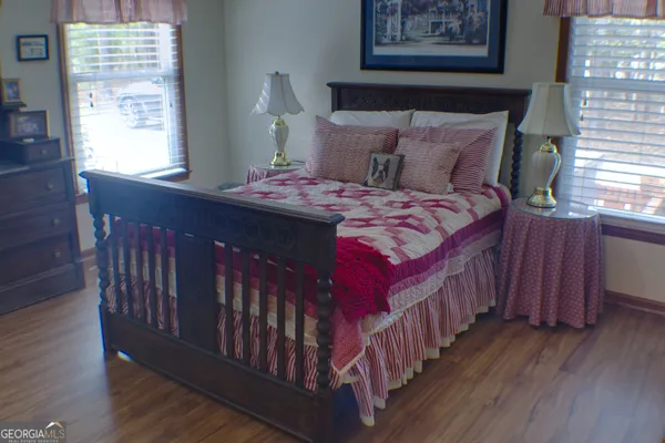 a bedroom with bed and a window