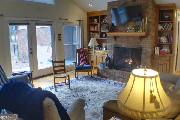 a living room with furniture and a fireplace