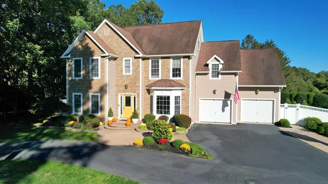 a front view of house with outdoor seating