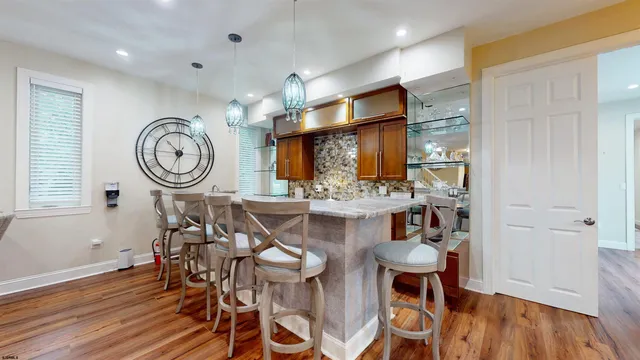 a spacious bathroom with a shower sink and mirror