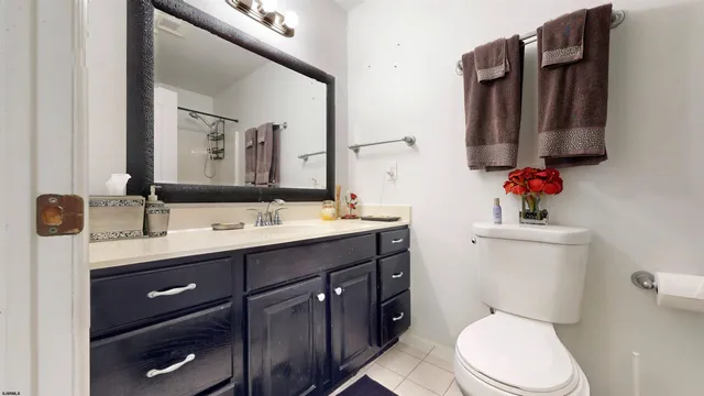 an aerial view of a house with a garden and lake view