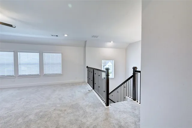a view of an empty room with stairs