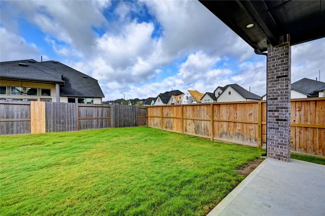 a view of backyard with green space