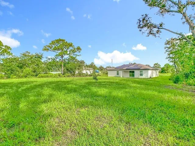a view of a house with a big yard