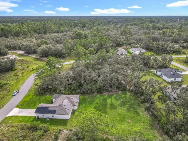 a view of a garden with an outdoor space