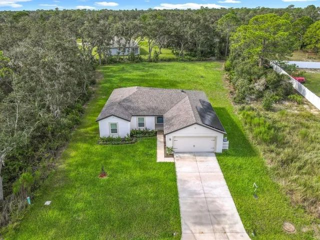 an aerial view of a house with garden