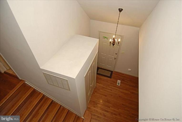 1826 Post Oak Trail Reston, VA 20191 - Photo 3 of 28 a view of a room with wooden floor