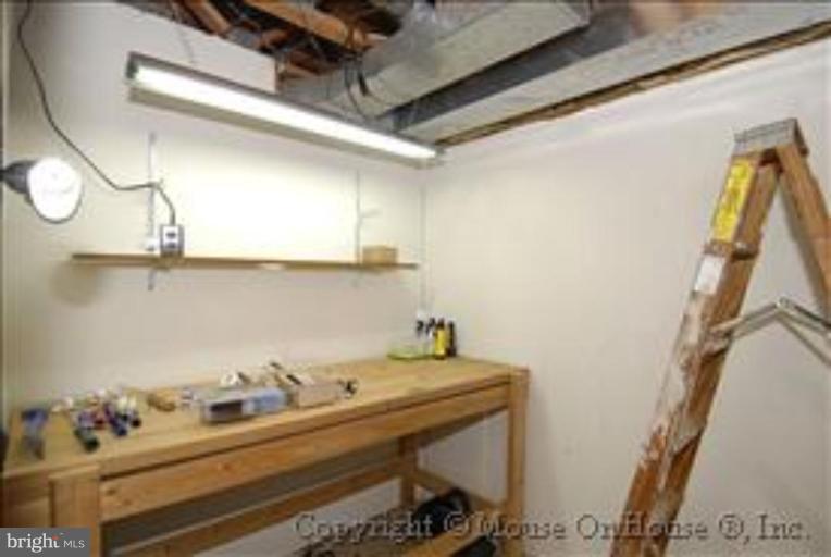 1826 Post Oak Trail Reston, VA 20191 - Photo 22 of 28 a bathroom with a sink and a mirror