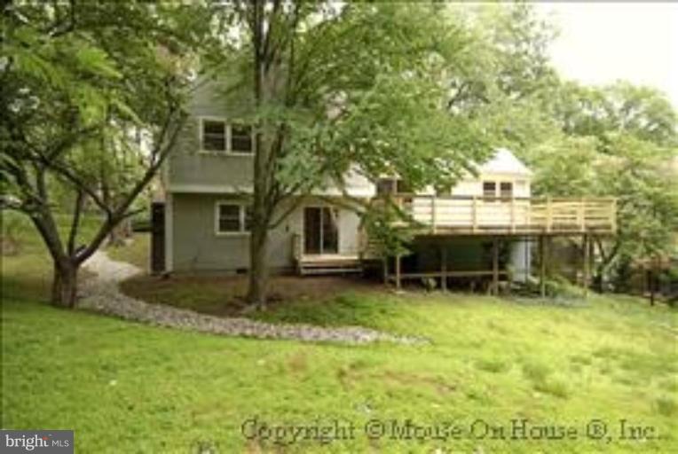 1826 Post Oak Trail Reston, VA 20191 - Photo 25 of 28 a backyard of a house with table and chairs