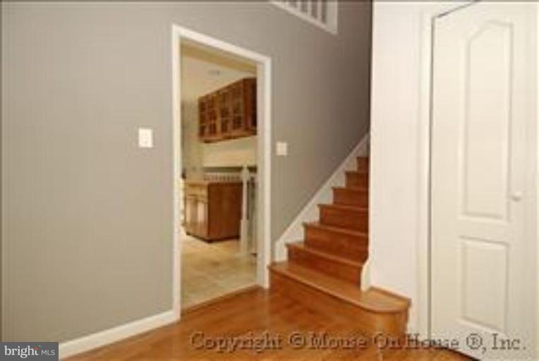 1826 Post Oak Trail Reston, VA 20191 - Photo 10 of 28 a view of entryway and hall with wooden floor