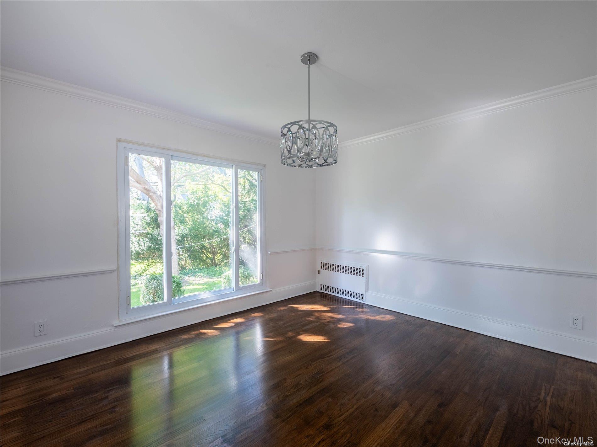 109 Chase Road Manhasset, NY 11030 - Photo 17 of 28 a view of a room with window and hardwood floor