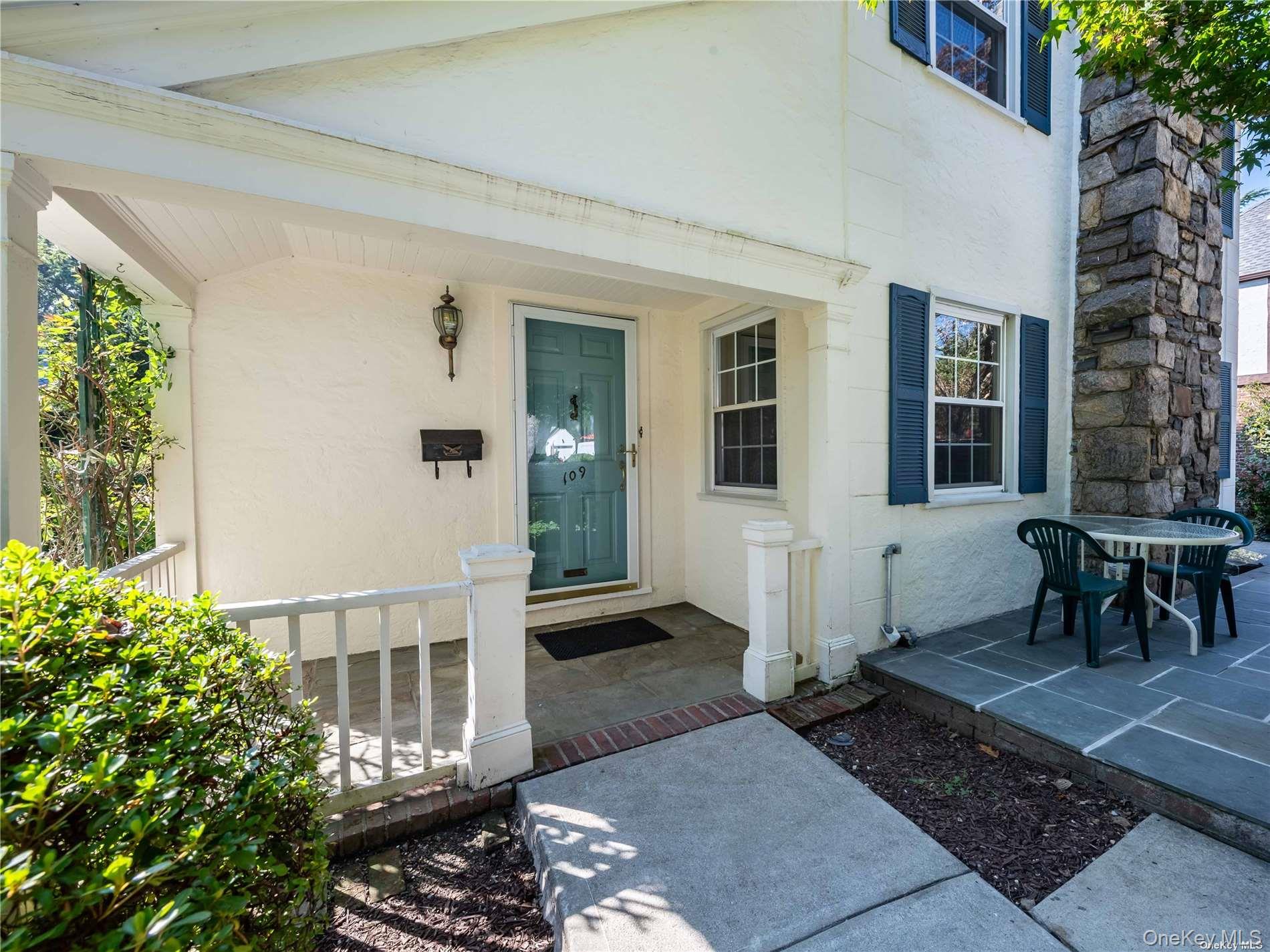 109 Chase Road Manhasset, NY 11030 - Photo 4 of 28 a view of a house with a patio