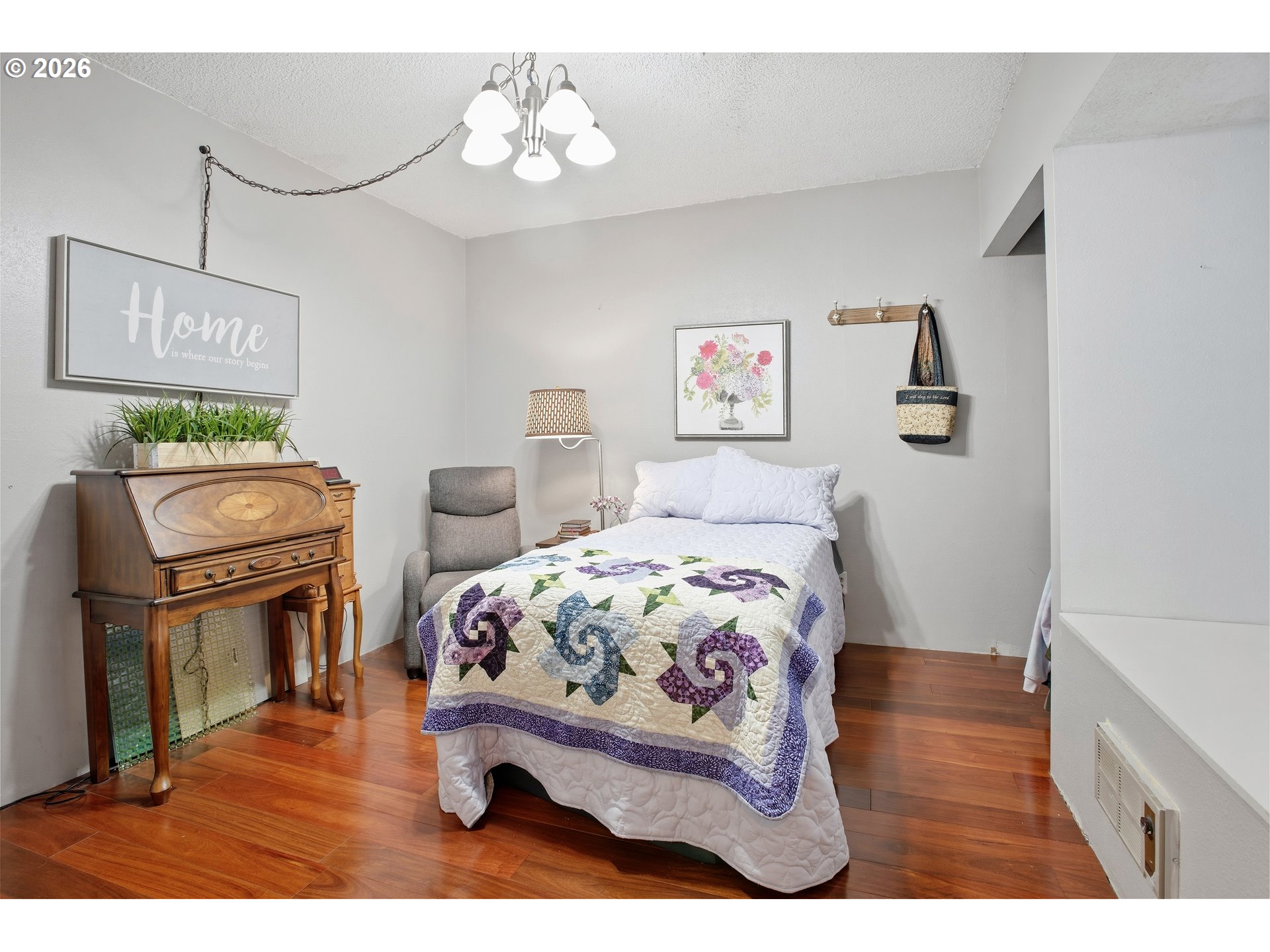 3506 Columbia Heights Road Longview, WA 98632 - Photo 11 of 21 a bedroom with a bed and wooden floor