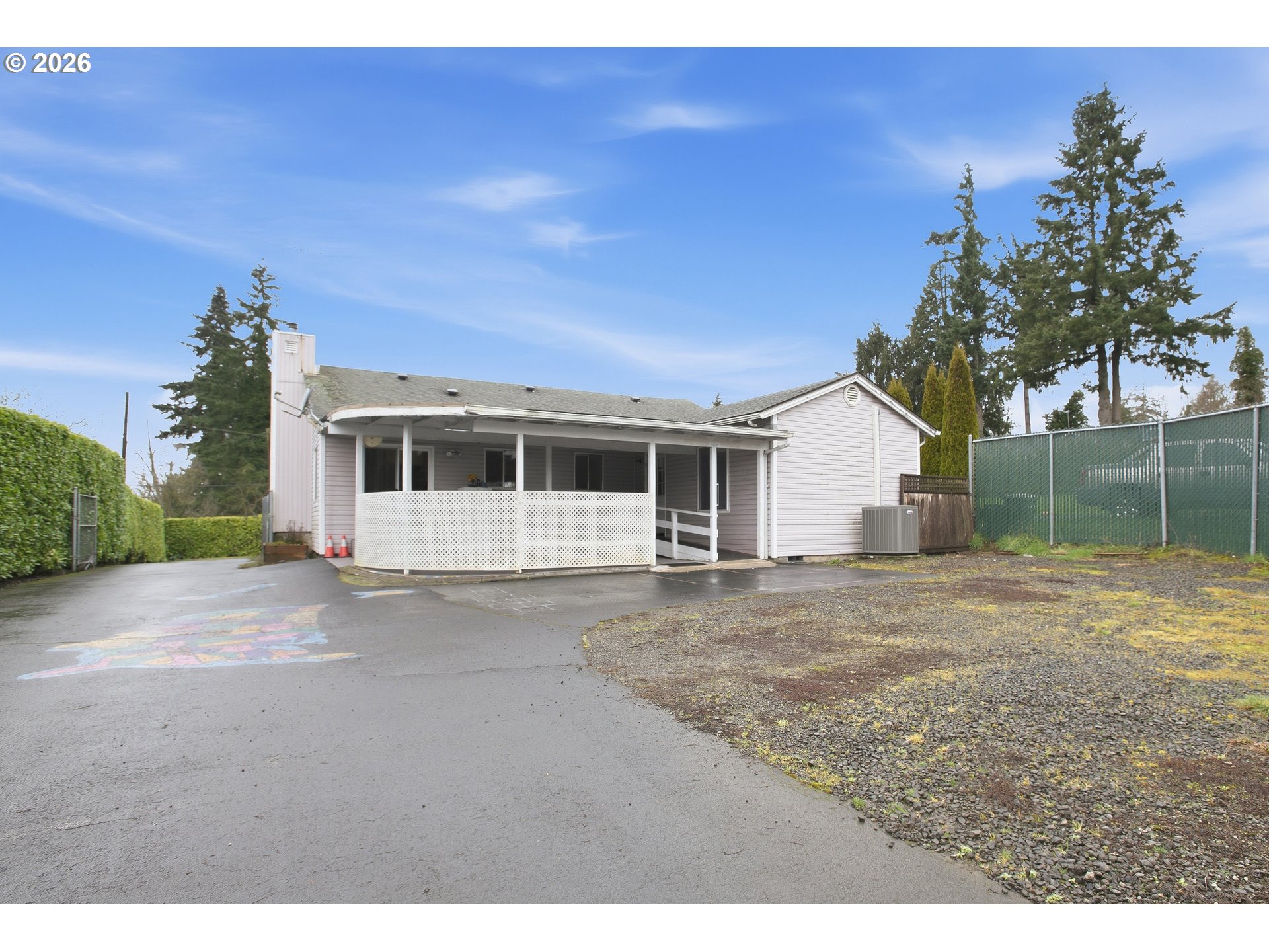3506 Columbia Heights Road Longview, WA 98632 - Photo 18 of 21 a front view of a house with a garden and trees