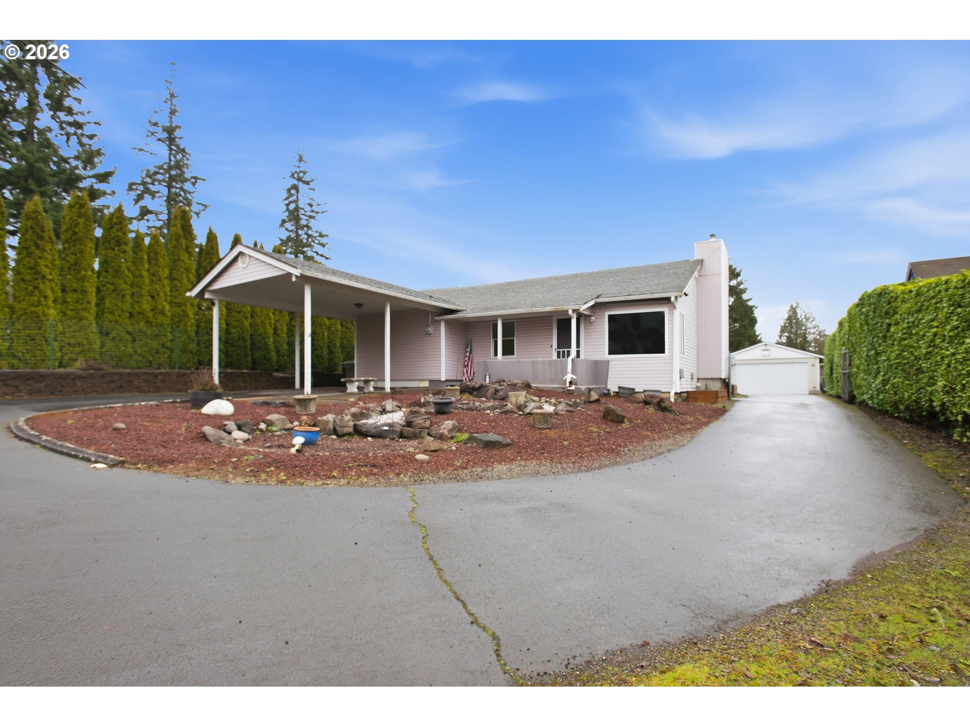 3506 Columbia Heights Road Longview, WA 98632 - Photo 2 of 21 a view of a patio with a table and chairs under an umbrella