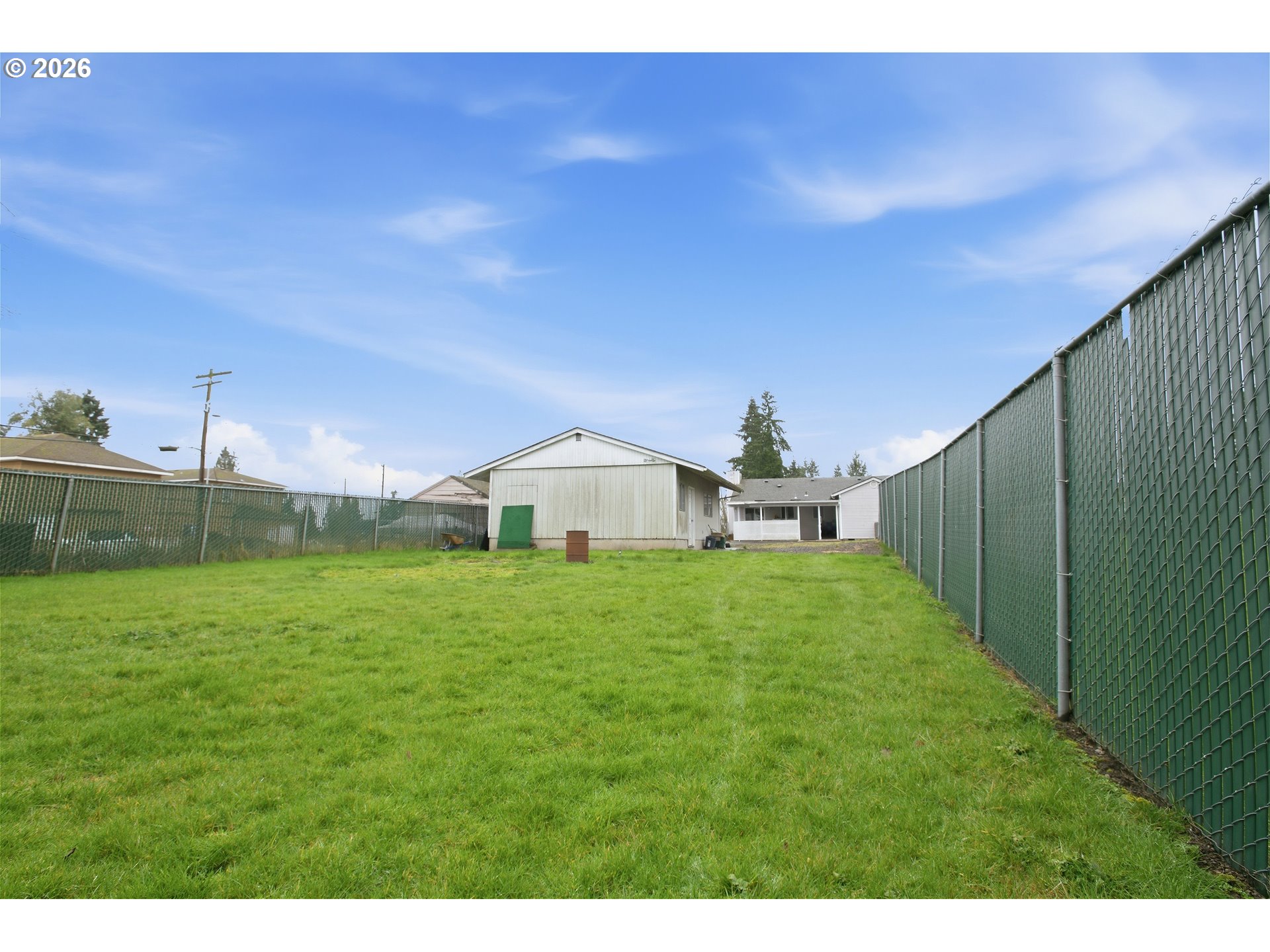 3506 Columbia Heights Road Longview, WA 98632 - Photo 21 of 21 a yellow and red house with a yard