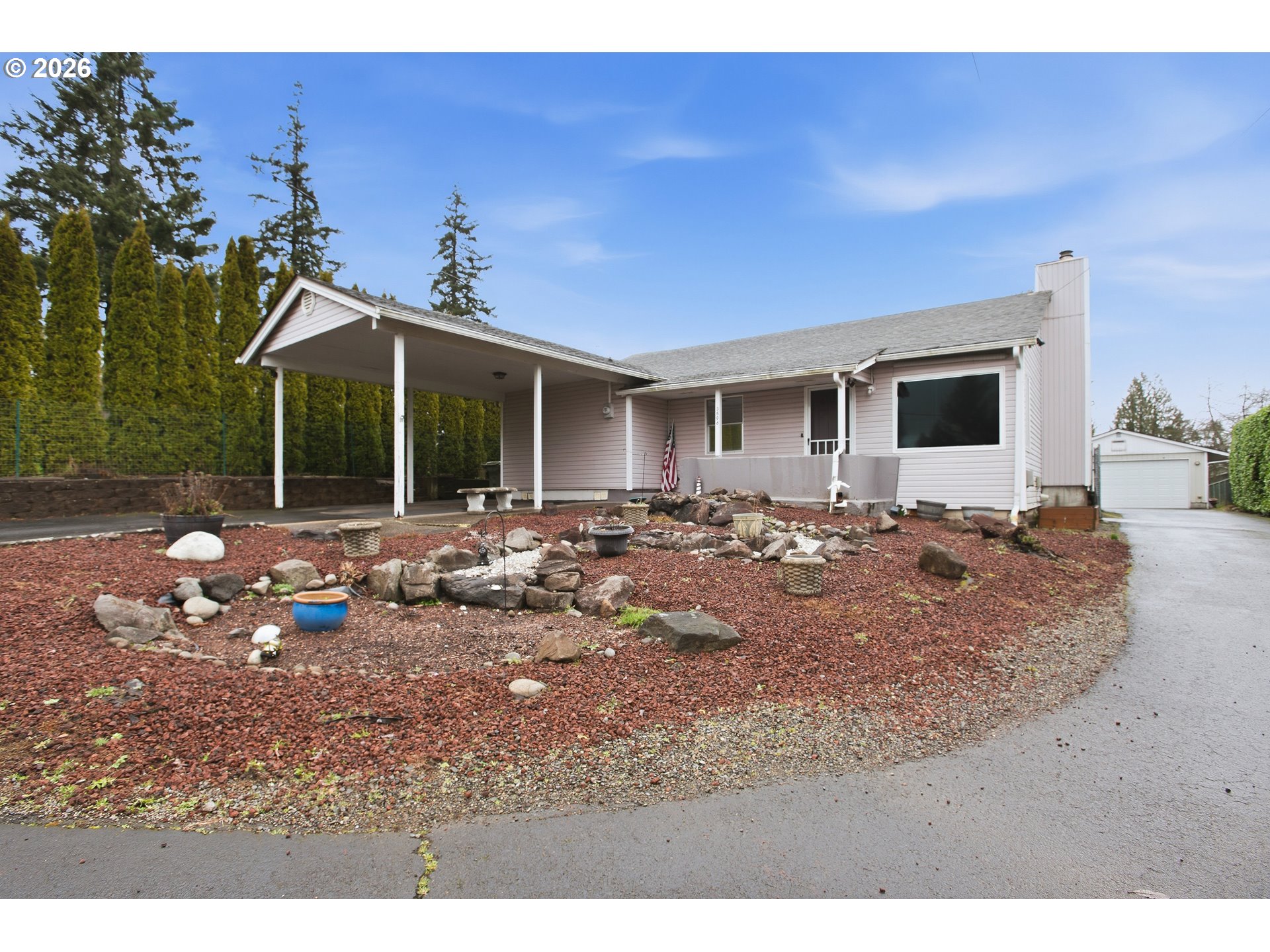 3506 Columbia Heights Road Longview, WA 98632 - Photo 3 of 21 a view of a patio with a table and chairs under an umbrella