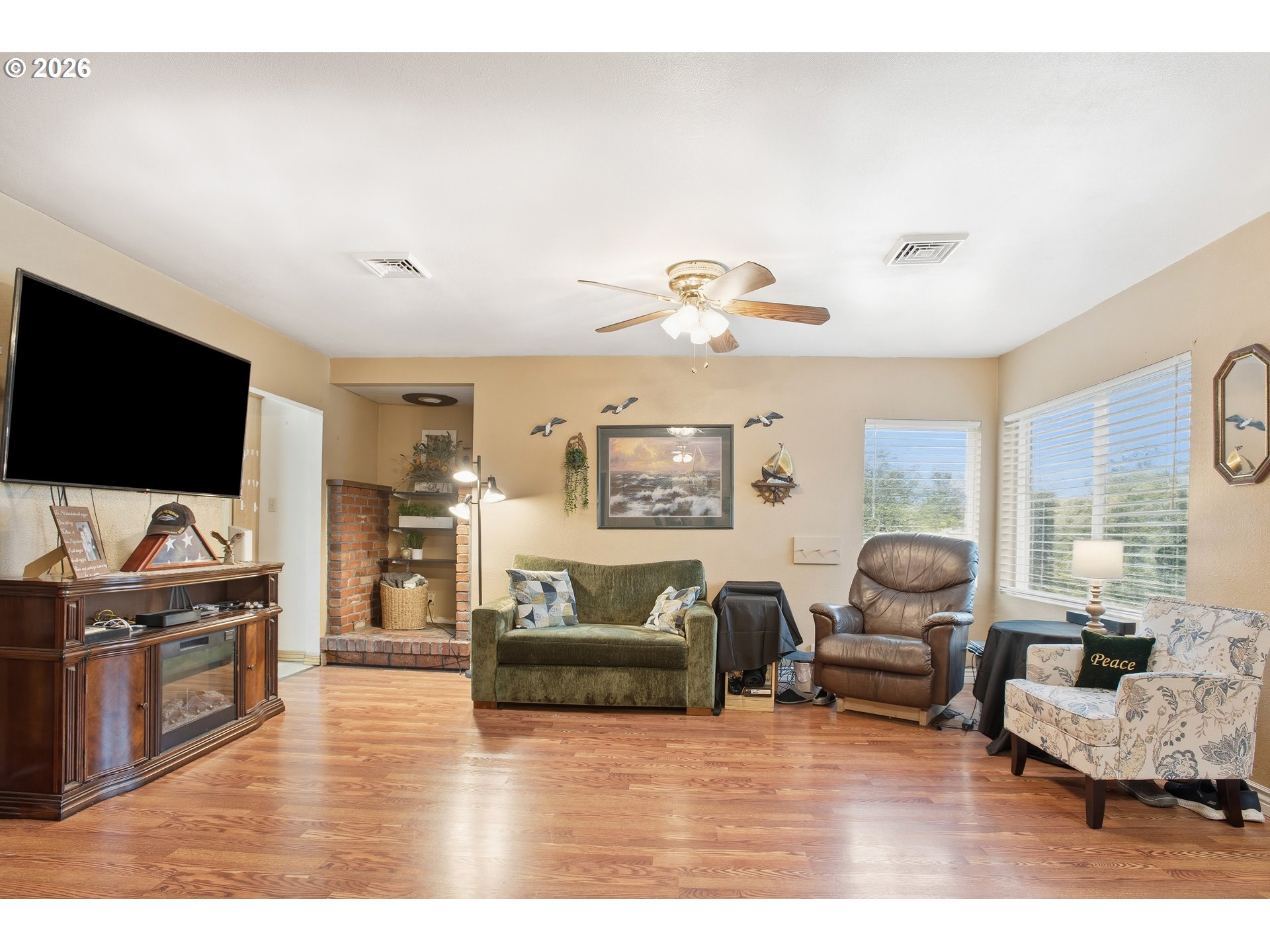 3506 Columbia Heights Road Longview, WA 98632 - Photo 4 of 21 a living room with furniture and a flat screen tv