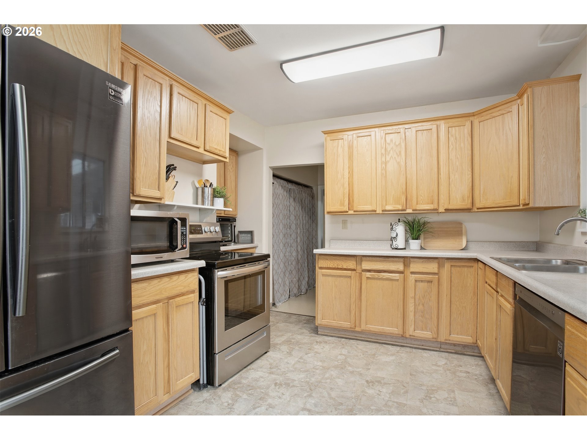 3506 Columbia Heights Road Longview, WA 98632 - Photo 8 of 21 a kitchen with a sink stove and refrigerator