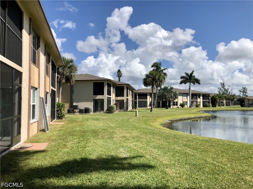 16881 Davis Road, Unit 214 Fort Myers, FL 33908 - Photo 35 of 46 a view of a house with swimming pool and sitting area