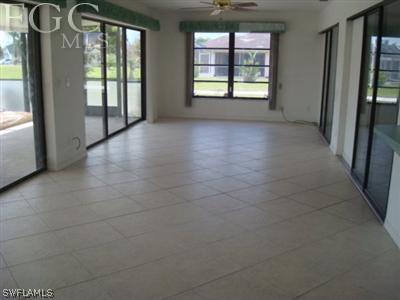 223 Danby Road Lehigh Acres, FL 33936 - Photo 3 of 10 a view of a hallway with windows