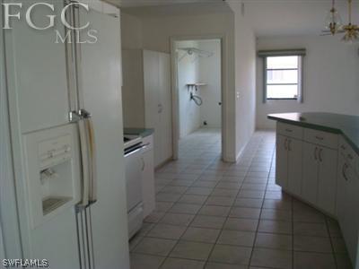 223 Danby Road Lehigh Acres, FL 33936 - Photo 6 of 10 a spacious bathroom with a granite countertop shower