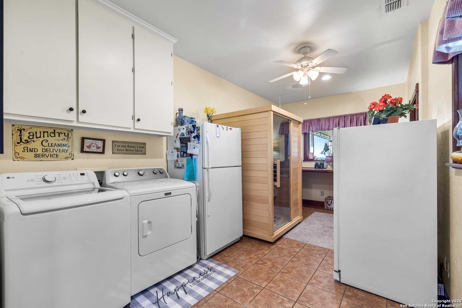 247 Huntleigh Road South Ingram, TX 78025 - Photo 14 of 41 a view of a kitchen with refrigerator and cabinets