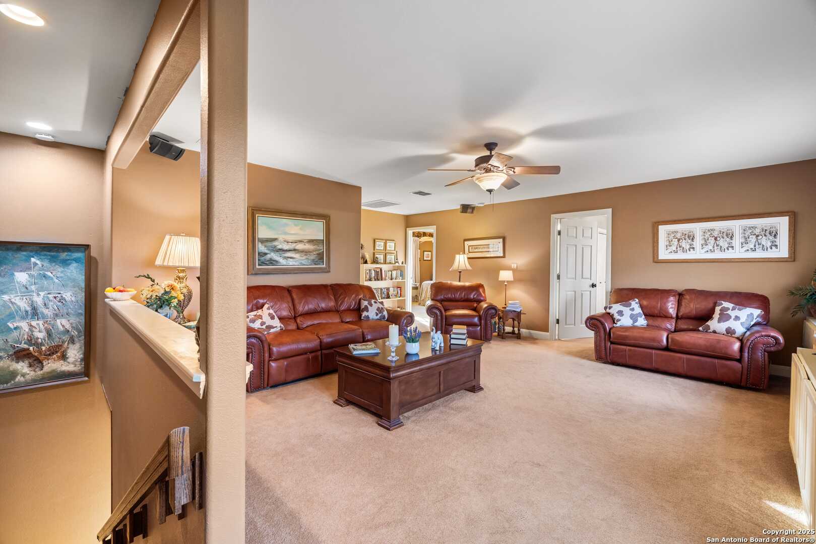 247 Huntleigh Road South Ingram, TX 78025 - Photo 29 of 41 a living room with furniture and a chandelier