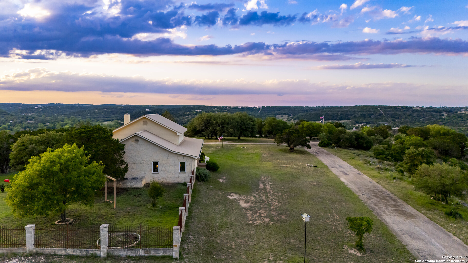 247 Huntleigh Road South Ingram, TX 78025 - Photo 3 of 41 a view of a lake with a yard