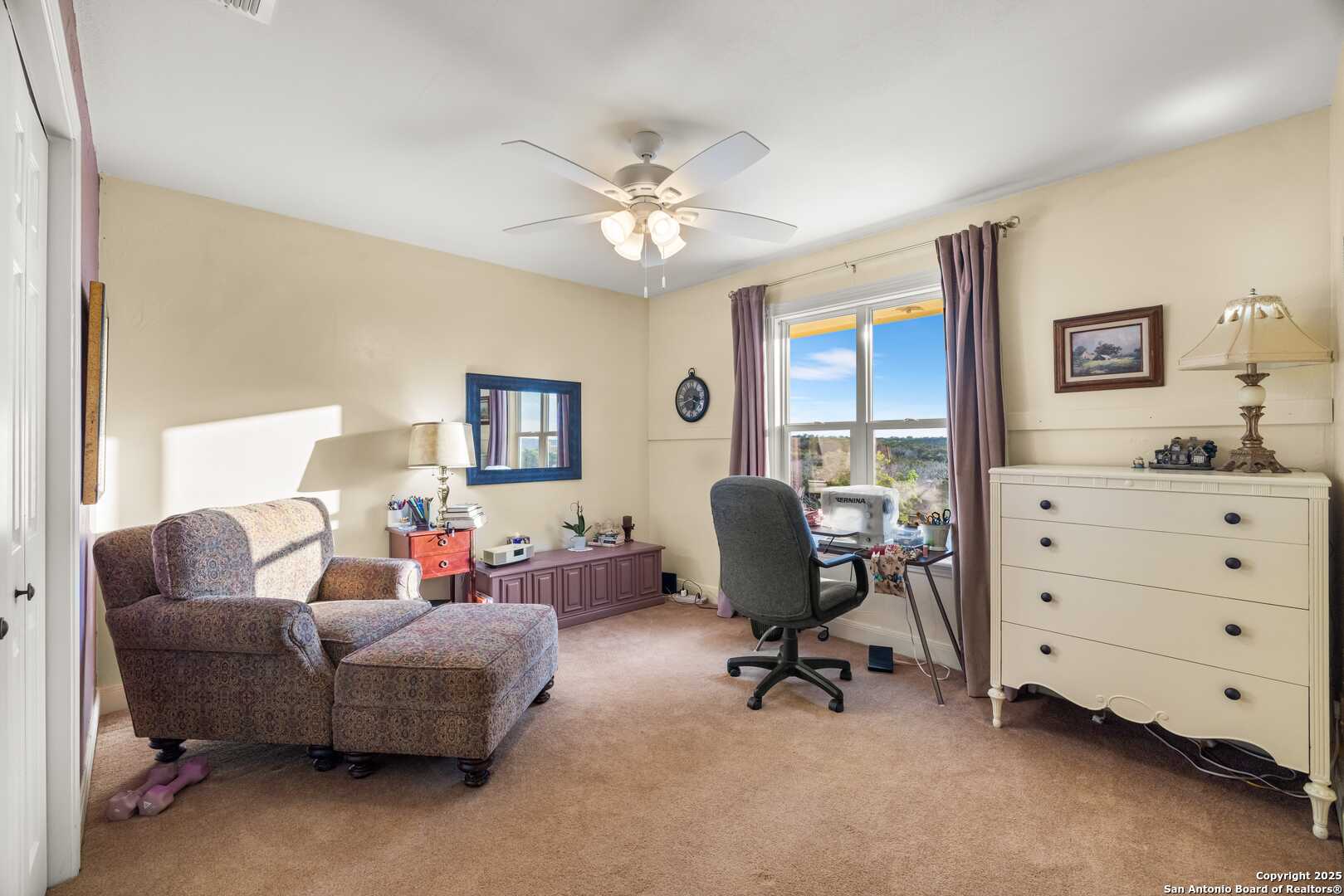 247 Huntleigh Road South Ingram, TX 78025 - Photo 32 of 41 a living room with furniture and a ceiling fan