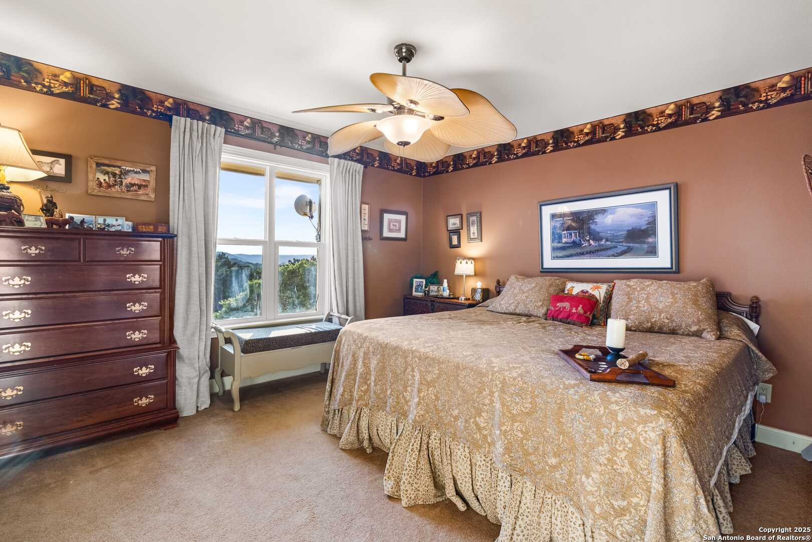 247 Huntleigh Road South Ingram, TX 78025 - Photo 38 of 41 a bed room with a bed and a chandelier