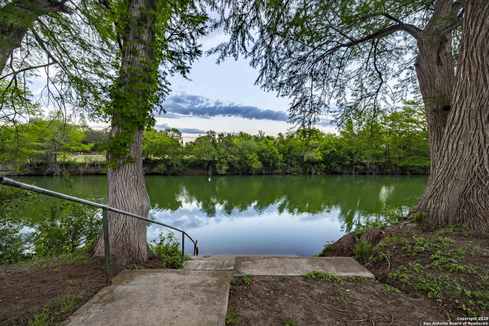 247 Huntleigh Road South Ingram, TX 78025 - Photo 41 of 41 a wooden bench sitting next to a lake