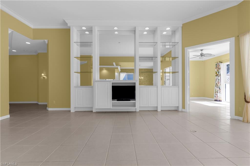 3790 Whidbey Way Naples, FL 34119 - Photo 15 of 49 a view of an empty room with a fireplace