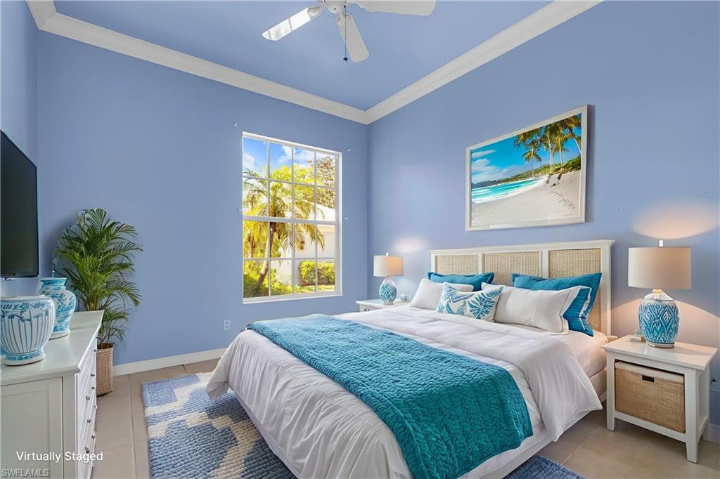 3790 Whidbey Way Naples, FL 34119 - Photo 27 of 49 a bedroom with a bed and a window