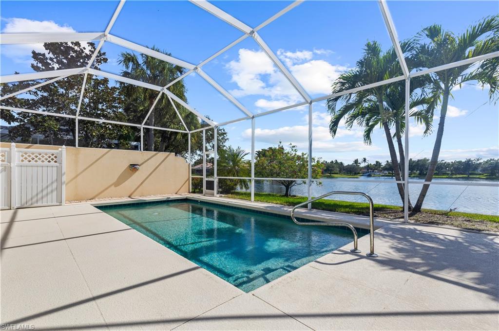 3790 Whidbey Way Naples, FL 34119 - Photo 44 of 49 a view of a swimming pool with a patio and a yard