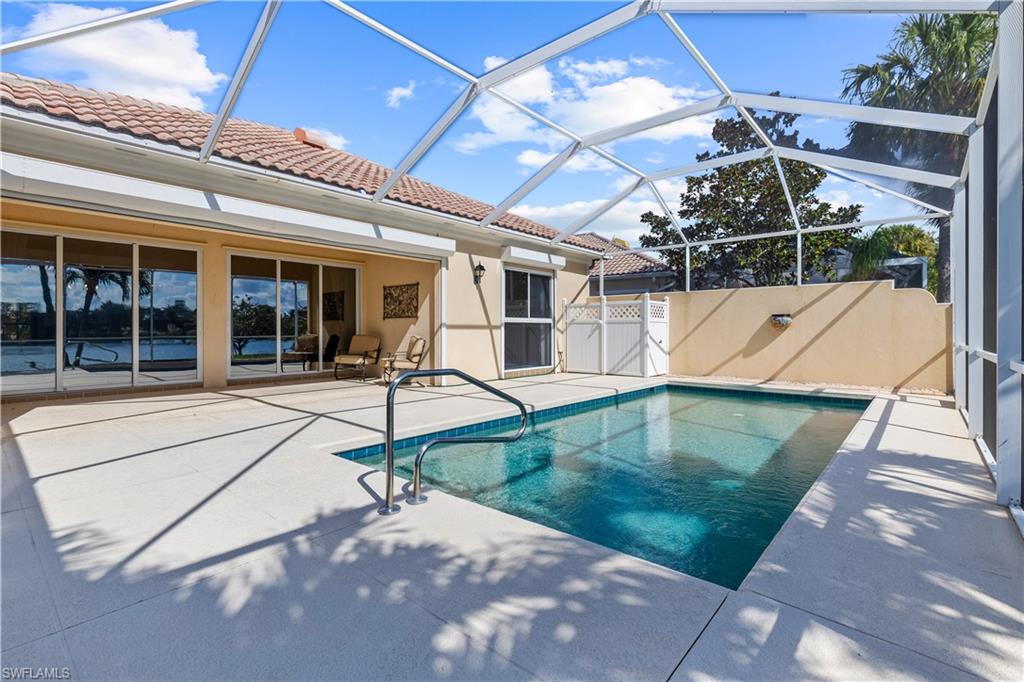 3790 Whidbey Way Naples, FL 34119 - Photo 45 of 49 a view of a patio with a table and chairs
