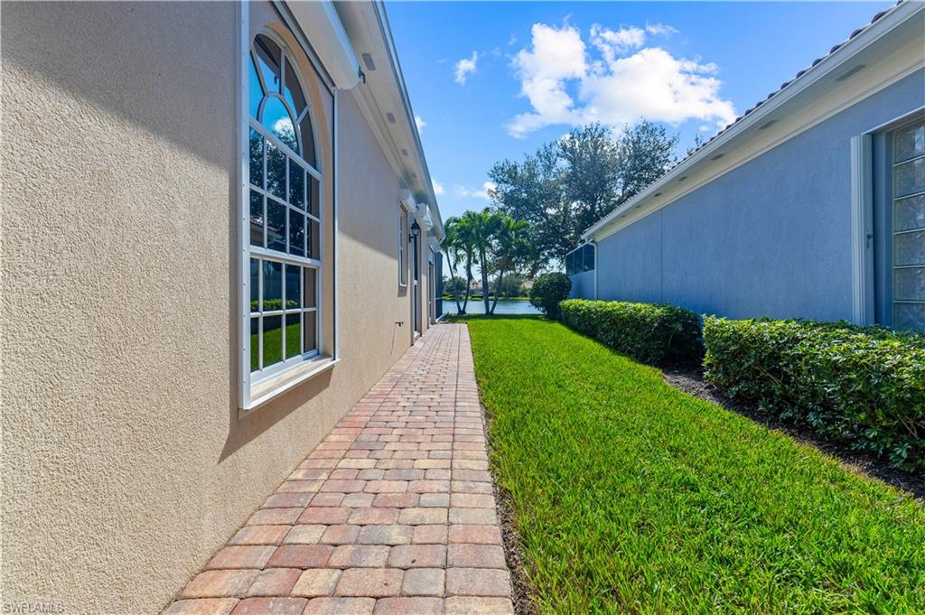 3790 Whidbey Way Naples, FL 34119 - Photo 7 of 49 a view of a pathway with a house