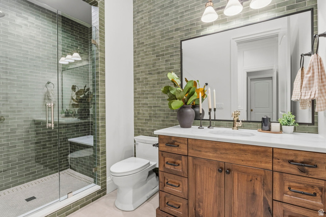 115 East Hidden Ridge Lane, Unit 42 Mapleton, UT 84664 - Photo 73 of 103 Bathroom featuring a glass-enclosed shower with subway tile surround, a built-in shower bench, and hexagonal mosaic floor tiles