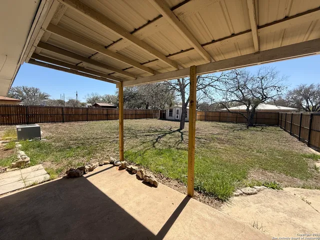 a view of a backyard with a garden
