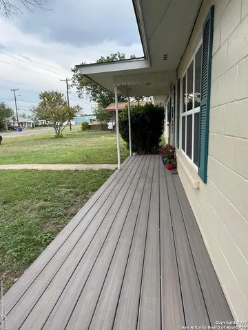 a view of a park with large trees