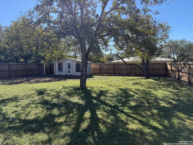 a view of backyard with green space