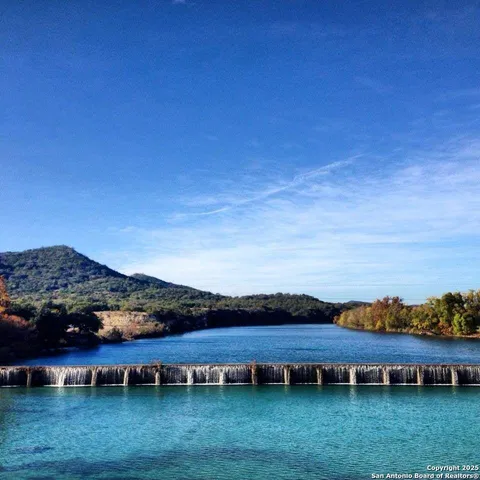a view of lake with green space