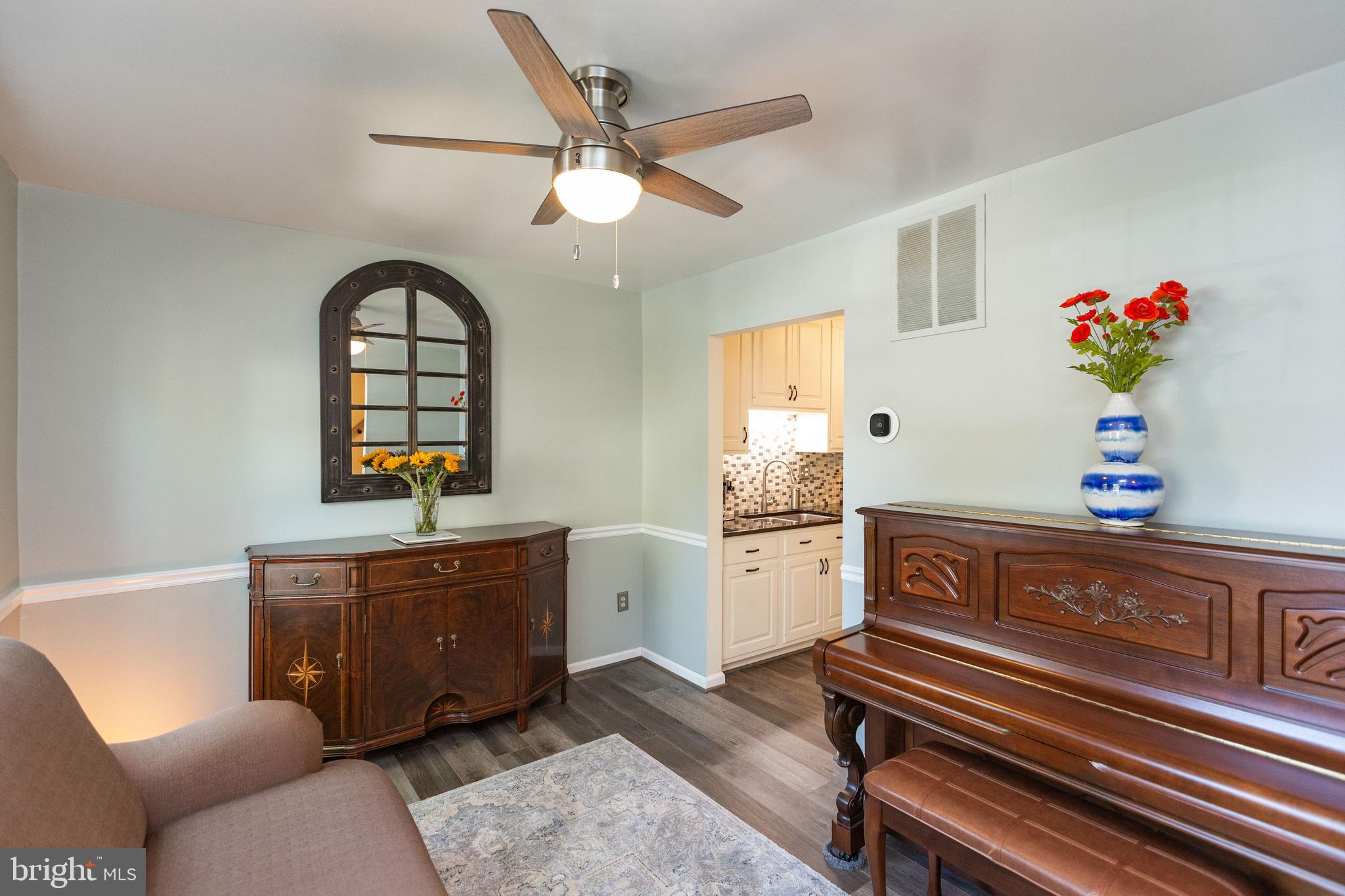 2431 Alsop Court Reston, VA 20191 - Photo 4 of 34 Chair Rail & Ceiling Fan in Living Room