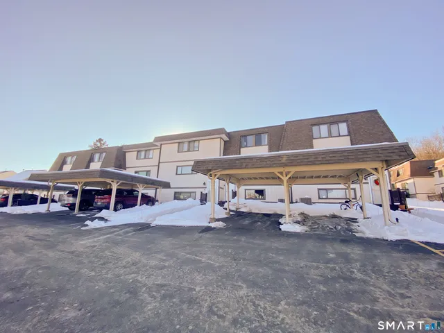 a view of a big house with many windows